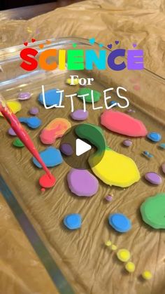 a wooden table topped with lots of colorful paint