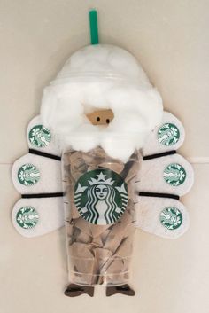 the starbucks cup is made out of coffee beans and cotton swaddled in fake fur