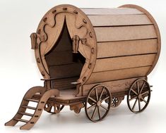 a wooden model of a horse - drawn wagon with its doors open and wheels down