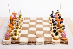 a chess board made out of marshmallows and carrots with the words prom on it