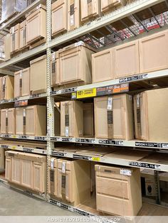 the shelves are full of wooden cabinets and drawers for sale in a store or home improvement store