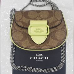 Coach Morgan Card Case On A Chain "Tbe" Tiny Bag Engery!!! Signature Coated Canvas & Smooth Leather Front Snap Closure, Fabric Lining Interior: Multifunction Pocket Detachable 23-1/4" Silvertone Chain Strap Can Be Used As Crossbody Or Shoulder Wear 5" L X 3-3/4" H X 2-1/4" W Style # Cj689 Please Refer To Photos Thank & Thank You For Visiting My Closet Brown Wallet With Chain Strap For Everyday Use, Elegant Coach Wallet On Chain With Chain Strap, Coach Wallets With Chain Strap For Everyday Use, Luxury Coach Wallet On Chain With Detachable Strap, Coach Crossbody Bag With Chain, Designer Brown Wallet On Chain With Chain Strap, Coach Luxury Crossbody Wallet On Chain, Coach Gold Wallet On Chain With Chain Strap, Coach Brown Shoulder Bag With Chain Strap