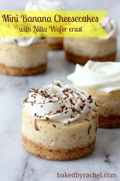 mini banana cheesecakes with vanilla wafer crust on a marble counter top, topped with whipped cream