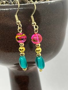 Simplistic beauty describes these pink, yellow and blue earring dangling from golden ear wires. Colorful Hypoallergenic Dangle Jewelry, Elegant Colorful Drop Earrings, Colorful Drop Earrings With Matching Set, Colorful Single Earring Jewelry As Gift, Pink Dangle Linear Earrings For Pierced Ears, Multicolor Dangle Linear Earrings, Multicolor Linear Earrings Gift, Elegant Hypoallergenic Multicolor Earrings, Green French Hook Earrings