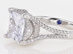 Pre-Owned Vanna K ™ for Bella Luce ® white diamond simulant 6.32ctw square and round, Platineve® ring. Measures approximately 0.44"L x 0.13"W and is not sizeable. Each Vanna K™ design has a signature label that features a lab created sapphire. The diamond equivalent weight is 4.52ctw..  This product may be a customer return, vendor sample, or on-air display and is not in its originally manufactured condition.  It may not be new.  In some instances, these items are repackaged by JTV. White Square Cut Fine Jewelry For Wedding, White Diamond Ring With Vs Clarity In Asscher Cut, Classic Square Cut Diamond Ring With Vs Clarity, White Cushion Cut Diamond Ring Fine Jewelry, White Cushion Cut Diamond Ring With Vvs Clarity, White Asscher Cut Diamond Ring With Vs Clarity, White Diamond Cut Square Cut Ring, Elegant Square Cut Diamond Ring With Vs Clarity, White Cushion Cut Jewelry With Center Stone