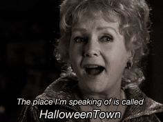 an old woman with her mouth open and the words halloween town written in front of her