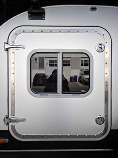 the inside of a train car with two windows