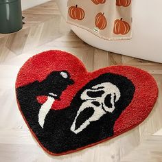 a heart shaped door mat with an image of a woman on it