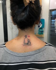 a woman with a small tattoo on her neck