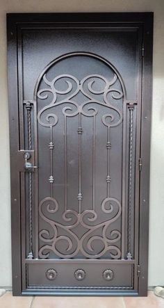 an iron door with decorative designs on it