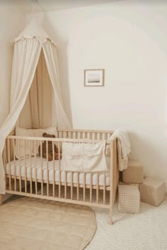 a baby's crib with a white canopy over it