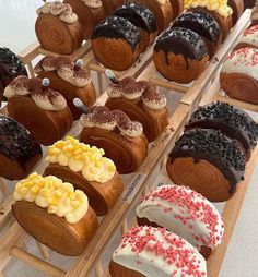 many different types of pastries are on display