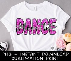 a t - shirt with the word dance on it and some flowers next to it