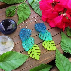 "Add a ton of Tropical FUN to your summertime outfits when you wear these Monstera Tropical Leaves Cascading Dangle Earrings! 💚 Each Monstera Inspired Leaf Pendant is made from double sided matte textured semi-translucent Teal, Green, & Chartreuse laser cut acrylic! So Lightweight - You'll barely know they are there! 💚 3 Colors of Cascading Tropical leaves measure about .75\" wide and flow 2.75\" long. Swaying with your every step, you get to pick which earring hooks these are made with! P Tropical Earrings, Green Chartreuse, Summertime Outfits, Laser Cut Acrylic, Monstera Leaf, Leaf Pendant, Earring Hooks, Handmade Business, Tropical Leaves