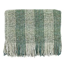 a green and white blanket with fringes