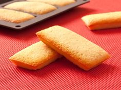 some biscuits are laying on a red table