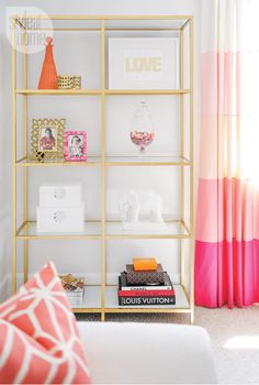 an instagram page for stephanie landes design, featuring pink and gold accents on shelving