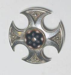 "An excellent quality vintage silver Caithness Jewellery Millefiori Celtic Cross brooch, fully hallmarked in Edinburgh in 1972, the second year of their registration, set with a central millefiori glass cabochon, good clear hallmark with a good safety \"C\" catch and good pin. This is the earliest example I've ever seen of Caithness jewellery. The cross is of round format and is one and a half inches. Millefiori loosely translates as a \"1000 flowers\", though it's original name was mosaic glass and that term was mostly applied to beads." Antique Wedding Bands, Jamais Vu, Antique Wedding, Celtic Cross, Silver Brooch, Mosaic Glass, Edinburgh, Vintage Silver, Silver Fashion