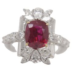 A brand new handcrafted ruby ring by Rewa Jewels. The ring's center stone is 3.38 carat Burmese ruby certified by Gem Research Swisslab (GRS) as natural, unheated, 'Pigeon blood' with the certificate number: 2023-101135. The centre ruby has been set with four claw prongs. The ruby was unearthed from Burma - one of the oldest ruby mines in the world. It has a vibrant red color, with radiance throughout the stones. There are some surface reaching inclusions on the table, typical of Burmese stones. Blood Ring, Thai Modern, Glamour Wedding, Blood Ruby, Black Glamour, Burmese Ruby, Vintage Black Glamour, Claw Prong, Glamorous Wedding