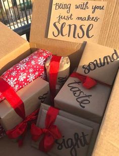 several boxes with wrapped presents sitting on top of each other