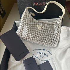 Brand New Prada April 2022 Re-Edition 2000 Crystal Bag, In White Satin. Full Set With Box, Dust-Bag, Receipt. It Was Purchased As A Gift, But I Never Got Around To Wearing It. Retail Price $2,350 Usd White Party Bag With Silver-tone Hardware, Designer White Shoulder Bag For Party, Designer White Bag For Party, Designer White Party Bag, Designer White Party Bags, Prada Crystal Bag, Bags Prada, Crystal Bags, Prada Bags