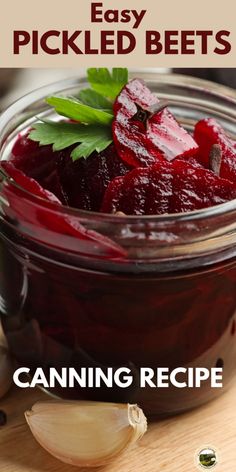 a jar filled with beets sitting on top of a wooden table