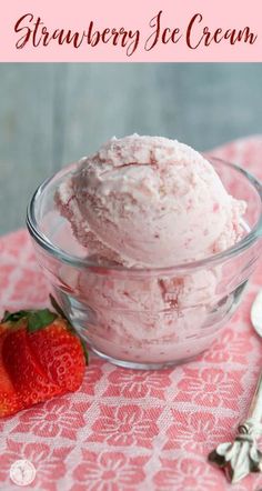 strawberry ice cream in a glass bowl on a pink tablecloth next to a spoon