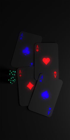 four playing cards with neon lights on them and dices in the middle one is black