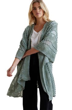 Easily layer this woven duster over any outfit that needs a pop of boho flair, complete with tonal pompoms and raised stitching. 38" length (size OS) No collar 3/4 length sleeves Open front 100% polyester Hand wash Imported Model stats: 5'10" height, 32" bust, 25" waist, 36" hip. Model is wearing size OS. Bohemian Spring Cardigan With Tassels, Bohemian Summer Outerwear With Tassels, Spring Beach Cover-up Duster, Spring Beach Cardigan With Tassels, Bohemian Spring Festival Duster, Bohemian Spring Duster For Festival, Bohemian Spring Open Front Duster, Bohemian Open Front Duster For Spring, Bohemian Spring Duster With Open Front