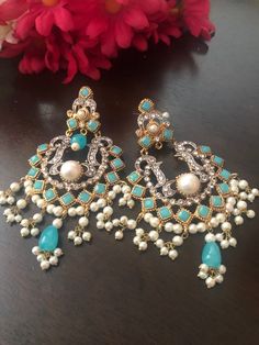 Delicacy and sophistication blends together to from magical and beautiful jewels! These elegant and big size chandbali earrings made with all fine care and royal emotion to give a surreal feeling! Shop these big size chandbali earrings in ice blue stones work. In stock and ready to ship. Color : ice blue Bollywood Style Chandbalis For Eid, Chandbali Danglers For Party, Bollywood Style Intricate Chandbalis For Celebration, Heavy Chandbali Chandelier Earrings For Party, Intricate Chandbali Chandelier Earrings For Party, Party Chandbali Danglers With Intricate Design, Bohemian Earrings For Wedding And Eid, Heavy Bollywood Chandbalis For Eid, Bohemian Meenakari Chandbalis For Party