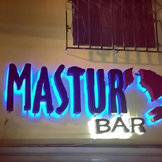 a neon sign that reads,'mastur's bar '