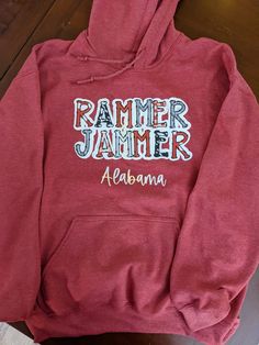 Show your Bama spirit with this fun, unique Rammer Jammer hoodie. Design is sublimated on glitter vinyl. Each sweatshirt is made to order. Alabama Hoodie, Alabama Shirt, Alabama Sweatshirt, Rammer Jammer, University Of Alabama, Roll Tide, Glitter Vinyl, Hoodie Design, Alabama