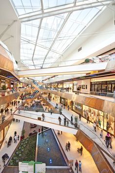 an overhead view of a mall with people walking around and shopping in the store area