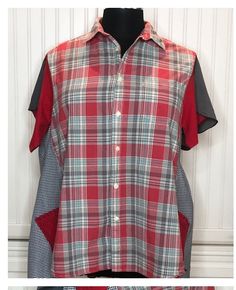 This easy wear button front tunic shirt was upcycled from several men's shirts and soft cotton tees. The sleeves are petal hard sleeves in shades of red and gray that compliment the shirts red and gray plaid. Notice the two large side pockets in red tee material with special embroidery stitching. The back hem is lengthened using the same upcycled red tee for a soft pleated ruffle.  The sides were widened and made more figure friendly by the addition of pleated black gingham check panels. I love this style as it is a beautiful as it is comfortable to wear.  This top is tunic length but does button up the front so wear it open as an over shirt or wear it as a tunic top. The sleeves cover the arms but have a bit of open flare at the bottom for ease and airiness.  This one of a kind top is ful Plaid Patchwork Button-up Tops, Plaid Patchwork Cotton Shirt, Collared Gingham Tops With Relaxed Fit, Plaid Patchwork Cotton Tops, Fall Patchwork Short Sleeve Shirt, Relaxed Fit Plaid Top With Buttons, Relaxed Fit Plaid Shirt For Daywear, Plaid Patchwork Short Sleeve Tops, Summer Plaid Tops With Patchwork