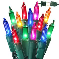 multi - colored christmas lights are lit up on a white background