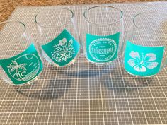 four glasses sitting on top of a counter