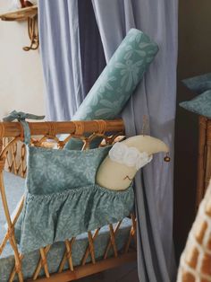 a baby crib with a stuffed giraffe in it