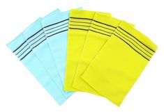 five pairs of yellow and blue cloths on white background with clipping for text