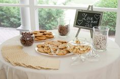 a white table topped with lots of cookies