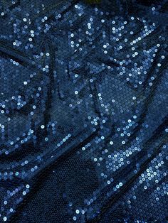 shiny blue sequins on black fabric