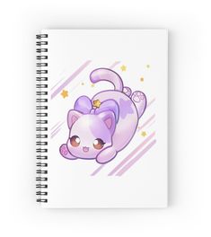 a spiral notebook with an image of a cat laying down on it's back