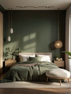 a bedroom with dark green walls and white bedding in the middle, along with wooden flooring