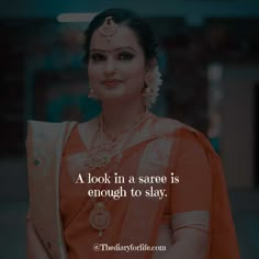 a woman wearing an orange saree with a quote on it that says, a look in