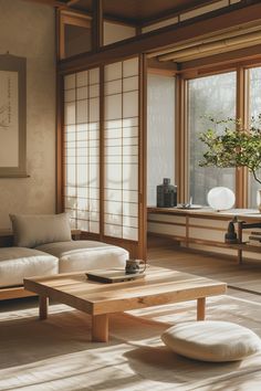 a living room filled with furniture and windows