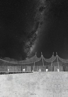 an image of people standing in front of a fence at night with the stars above