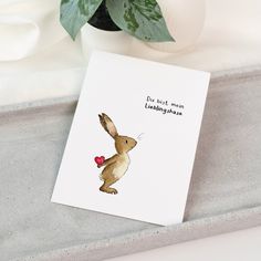 a card with a rabbit holding a heart on it's back and the words do not mean lubblinghabas