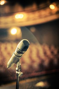 a microphone on a stand in front of a stage