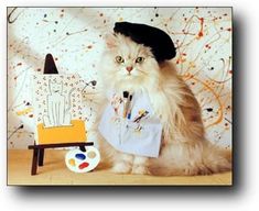 a cat wearing a hat and scarf sitting next to an easel with paint on it