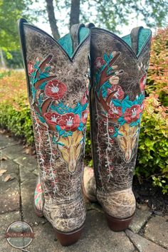 Corral A4374 Glow in the Dark Deer Head Western Boots Oh man, where do we begin? We love this new style from Corral Boots for so many reasons! The brown distressed leather looks vintage and rustic. Vibrant floral embroidery and a deer skull design make this one of the most unique pair of western boots we've seen! Need another reason to love them? Take them from day to night -- they glow in the dark! Tube Height 15" Heel Height 2" Vamp Leather: Cowhide Lining: Pig Toe Type: Snip Toe Style# A4374 Deer Skull, Corral Boots, Holiday Hours, Deer Skulls, A Deer, Deer Head, Skull Design, Distressed Leather, Looks Vintage