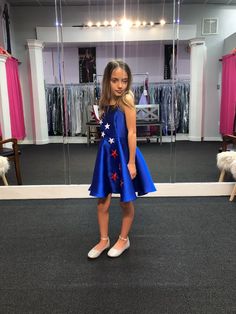 Marc Defang 5030 Red White & Blue Girls Pageant Fun Fashion Cape Detachable chiffon skirt/cape. Stars adorn he short a line dress. Perfect for Fun Fashion! Fourth of July - Independence Day Pageant Available Sizes: 4, 8, 12 Colors: Red/White/Blue Royal Blue Fitted Dress For Pageant, Fitted Sleeveless Dress For 4th Of July, Skirt Cape, Fashion Cape, Short A Line Dress, Cape Fashion, Short A, Line Dress, Chiffon Skirt